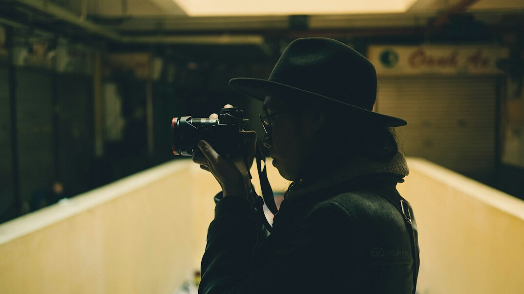 Film crew working with a camera on a set